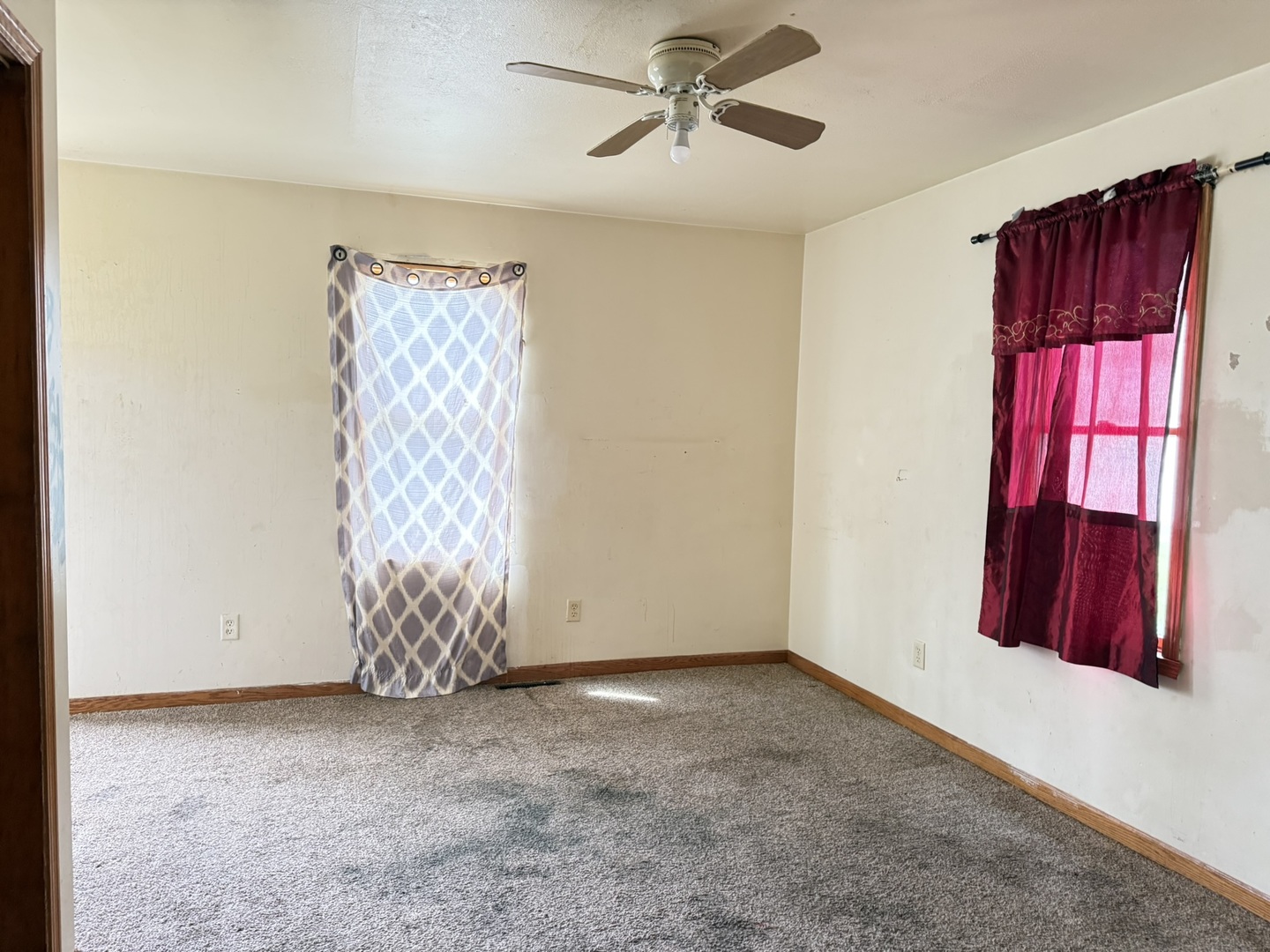 3245 9th Street Rockford, IL 61109 - Photo 24 of 26 a view of an empty room with window closet and chandelier fan