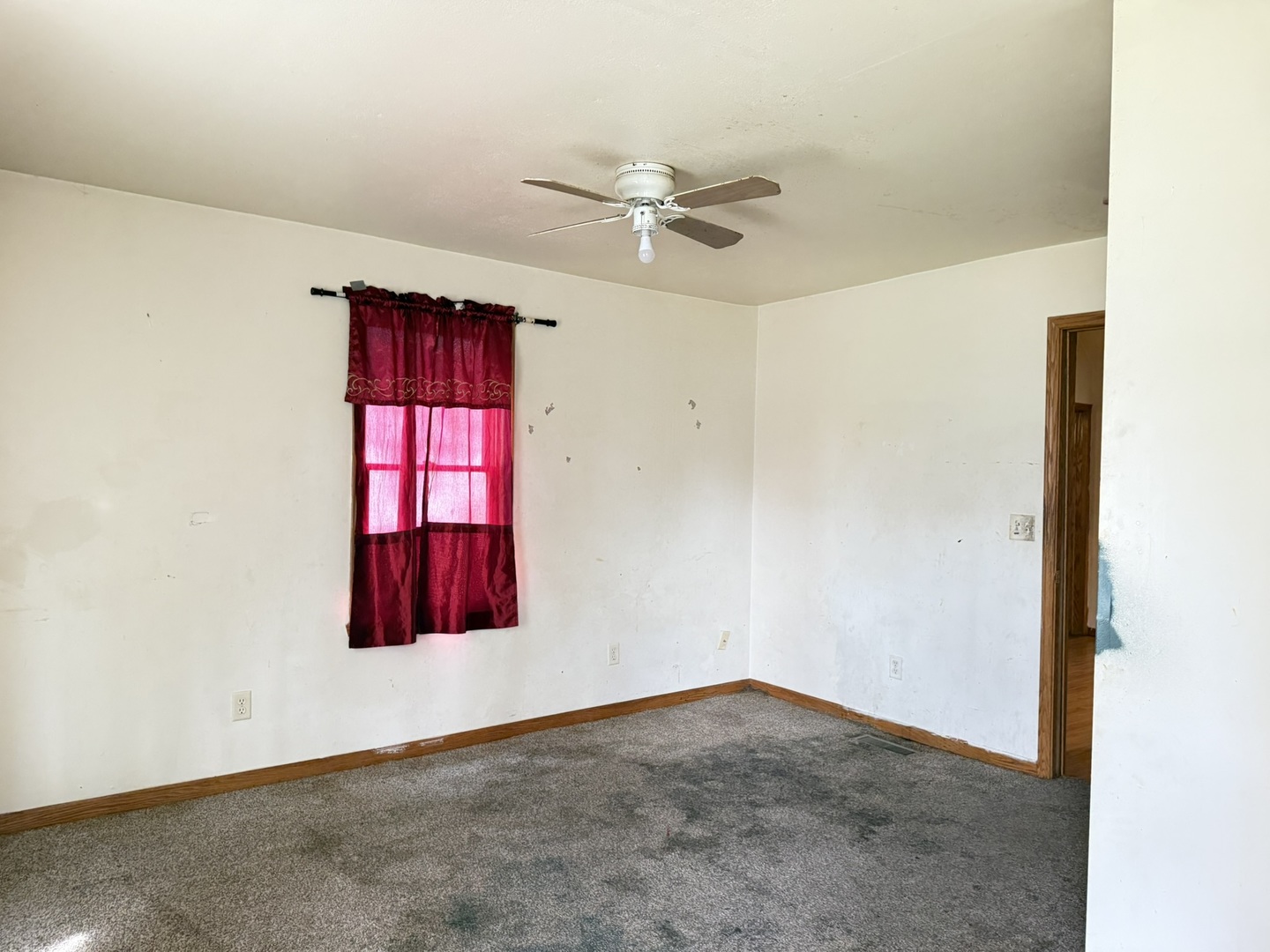3245 9th Street Rockford, IL 61109 - Photo 25 of 26 an empty room with windows and fan