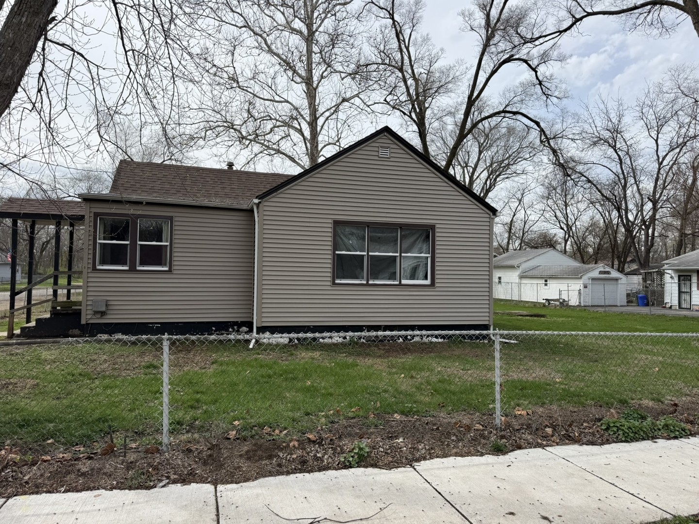 3245 9th Street Rockford, IL 61109 - Photo 3 of 26 a house that has a backyard