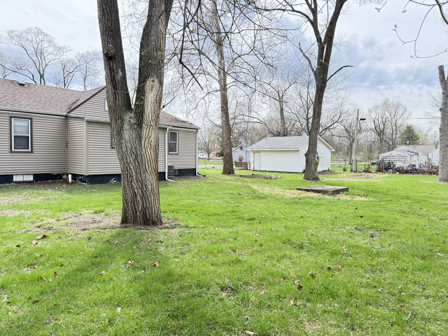 3245 9th Street Rockford, IL 61109 - Photo 8 of 26 a view of a house with a yard