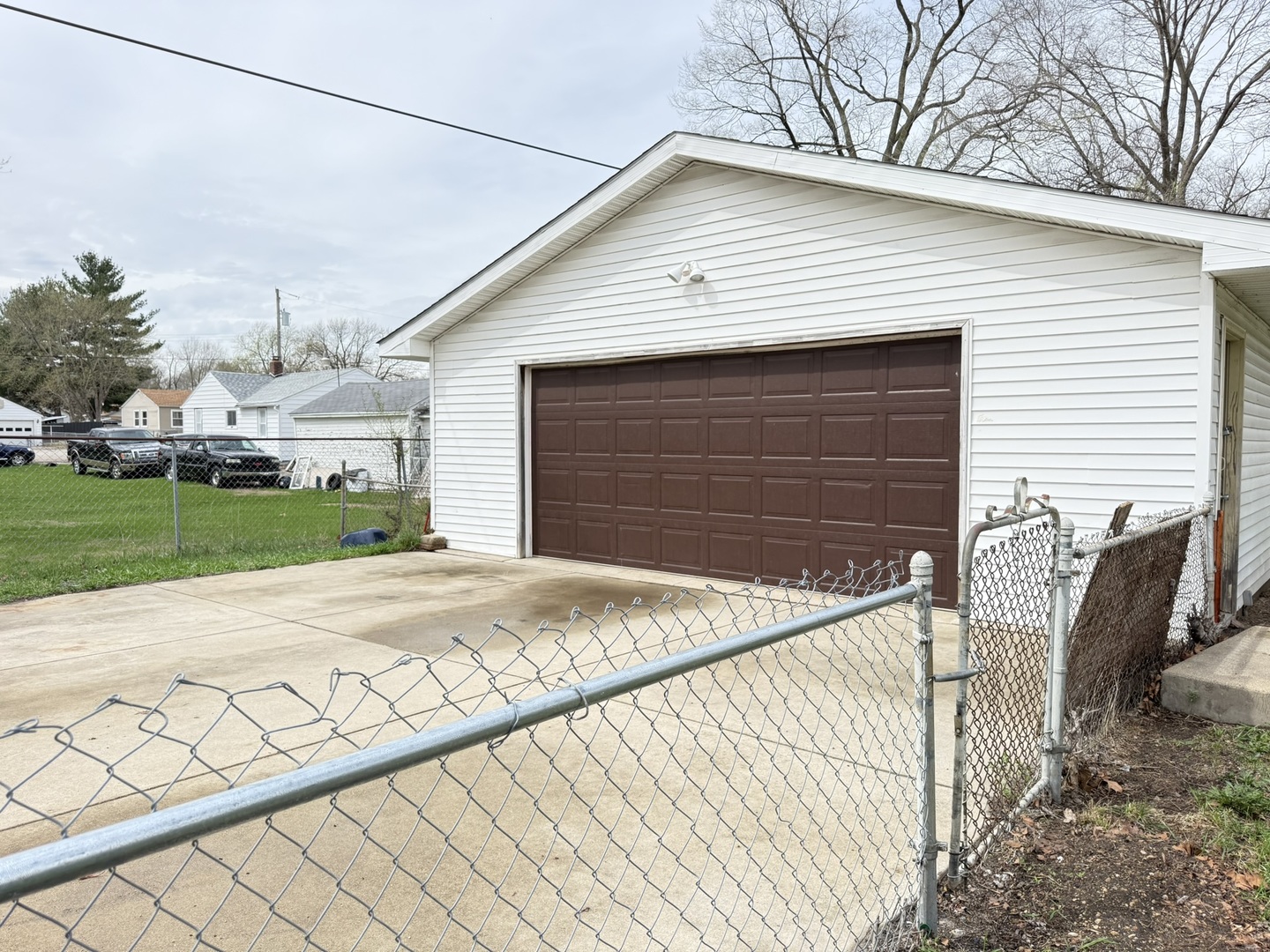 3245 9th Street Rockford, IL 61109 - Photo 9 of 26 a front view of a house with a yard and garage