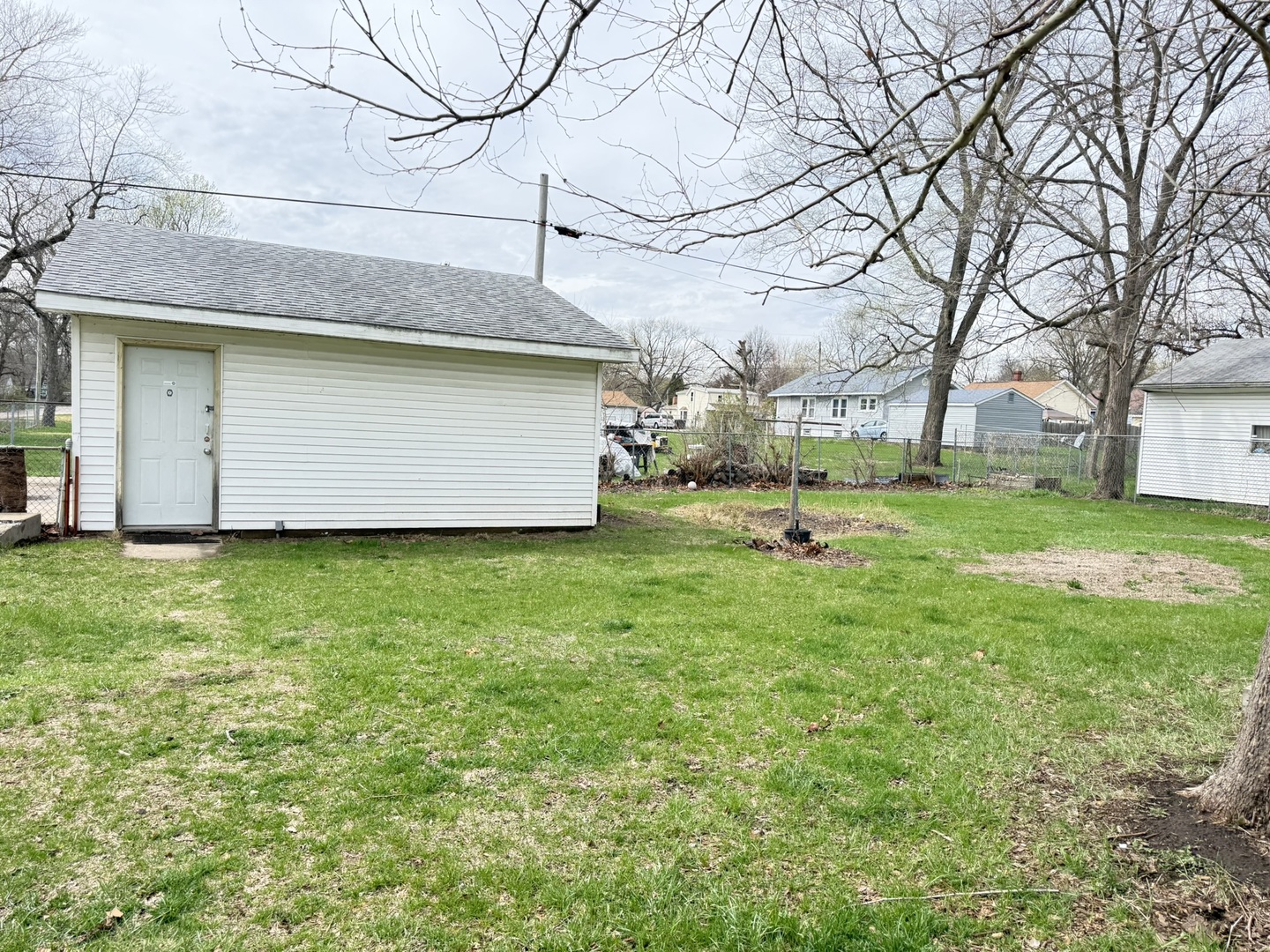 3245 9th Street Rockford, IL 61109 - Photo 10 of 26 a house view with a garden space
