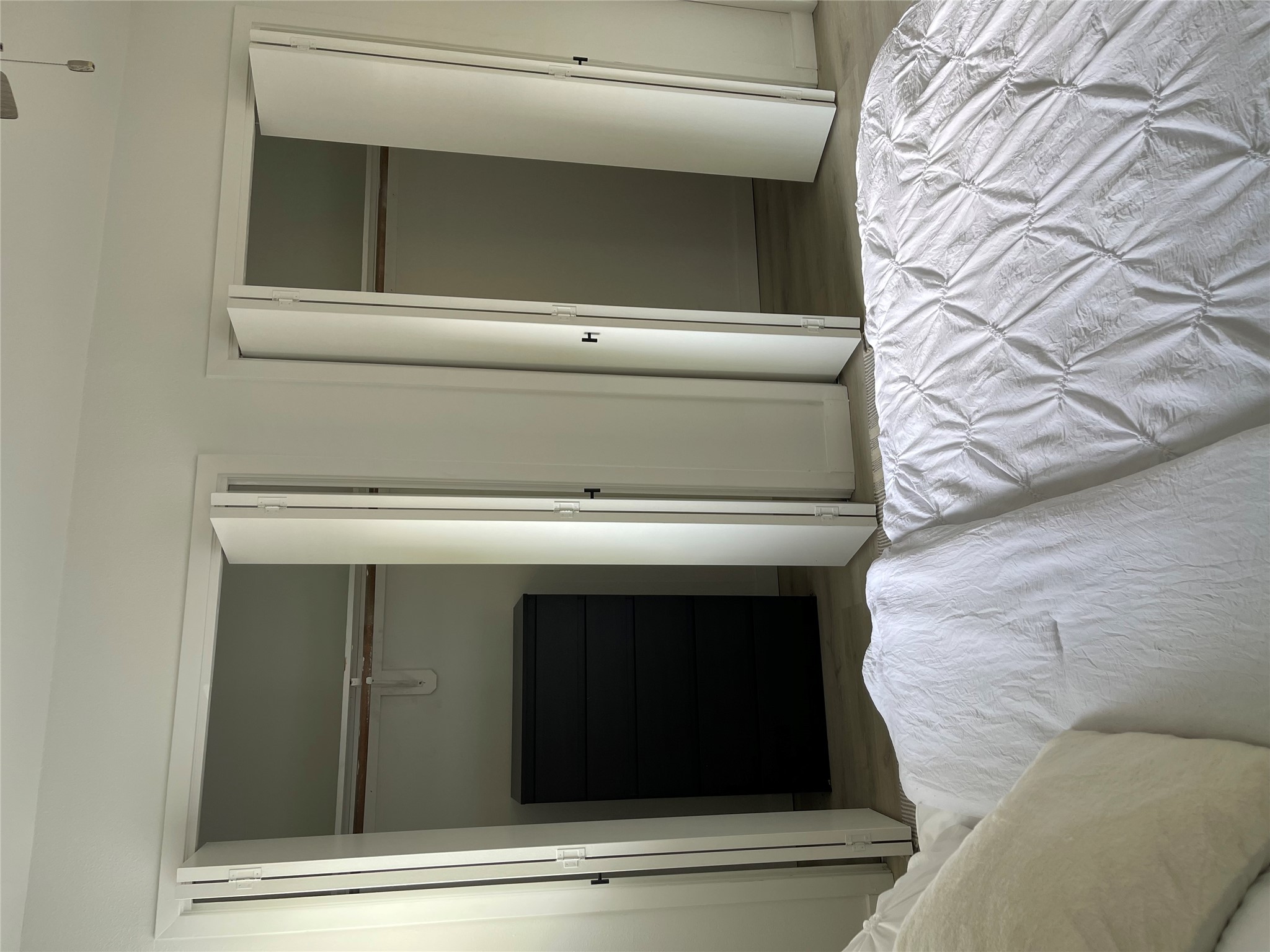 1714 Enfield Road, Unit 104 Austin, TX 78703 - Photo 7 of 14 Bedroom with wood finished floors and two closets