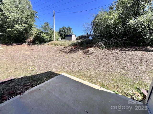 a view of a yard with an outdoor space