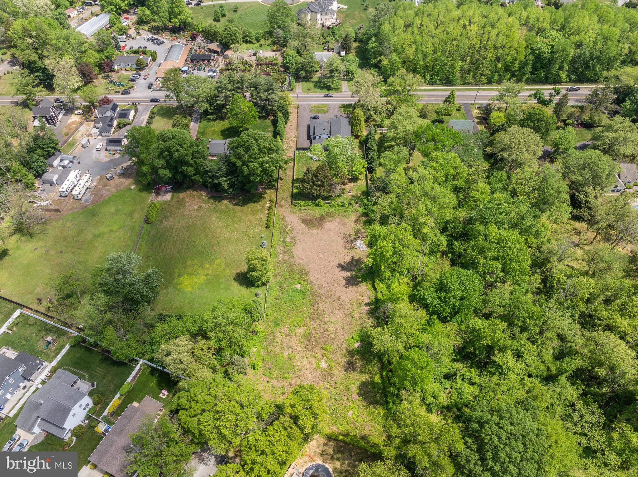 4327 Bridgeboro Road Moorestown, NJ 08057 - Photo 6 of 10 a view of a lush green forest with a lake