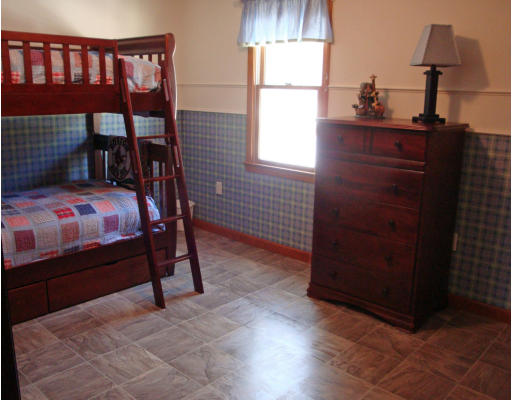 102 Barnett Road Sutton, MA 01590 - Photo 18 of 30 a bedroom with a bed and a window