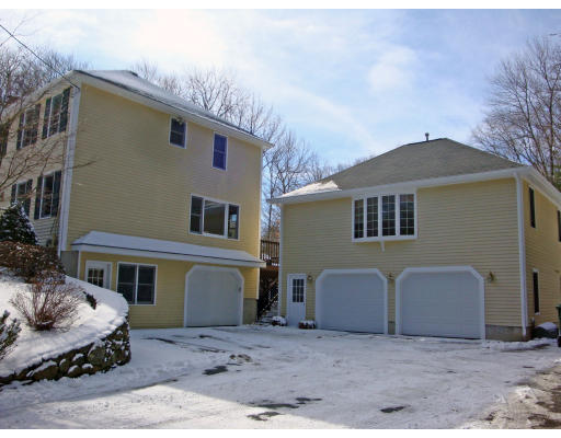 102 Barnett Road Sutton, MA 01590 - Photo 8 of 30 a front view of a house with a yard