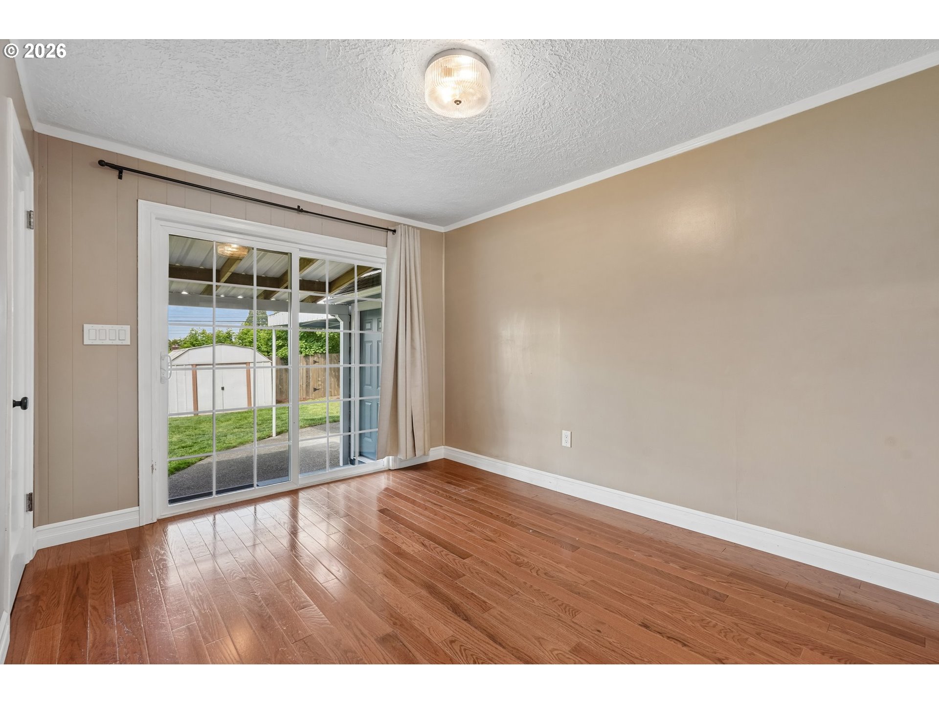 4204 Fir Street Vancouver, WA 98660 - Photo 14 of 37 a view of an empty room with wooden floor and a window