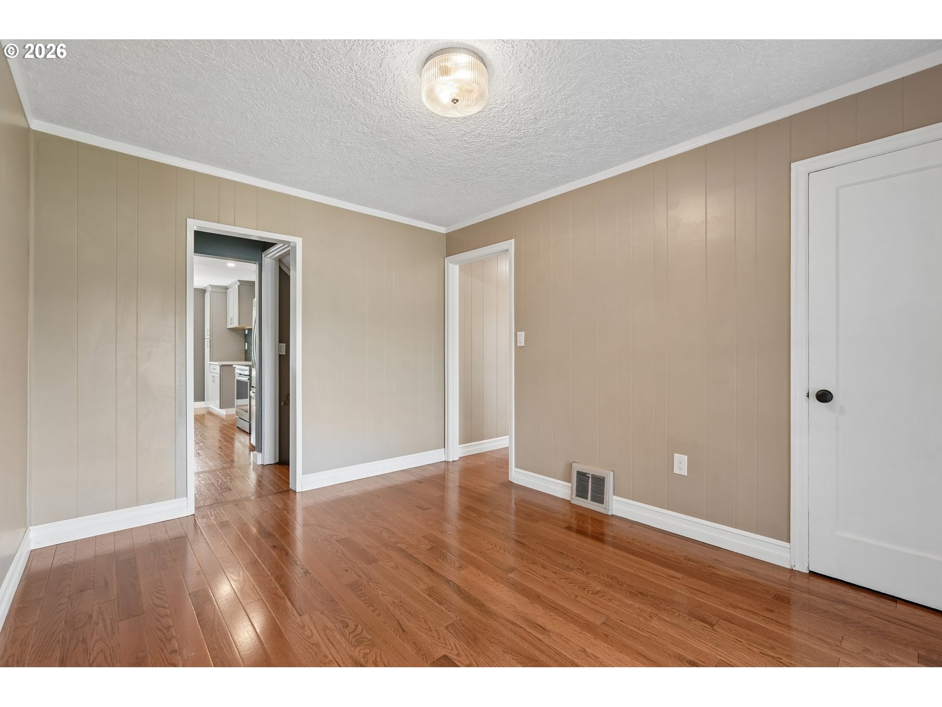 4204 Fir Street Vancouver, WA 98660 - Photo 15 of 37 a view of an empty room with wooden floor