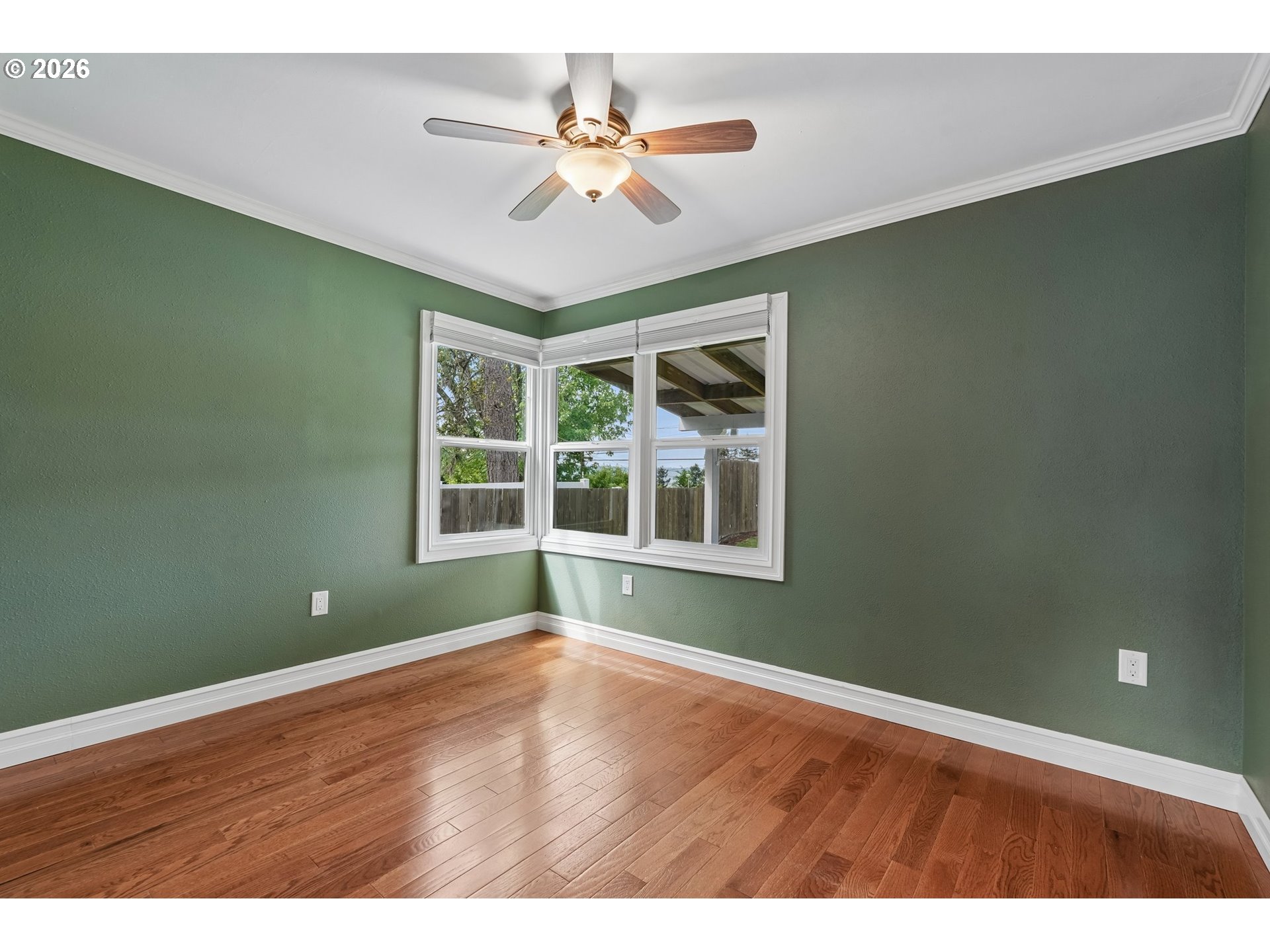 4204 Fir Street Vancouver, WA 98660 - Photo 18 of 37 an empty room with wooden floor and windows