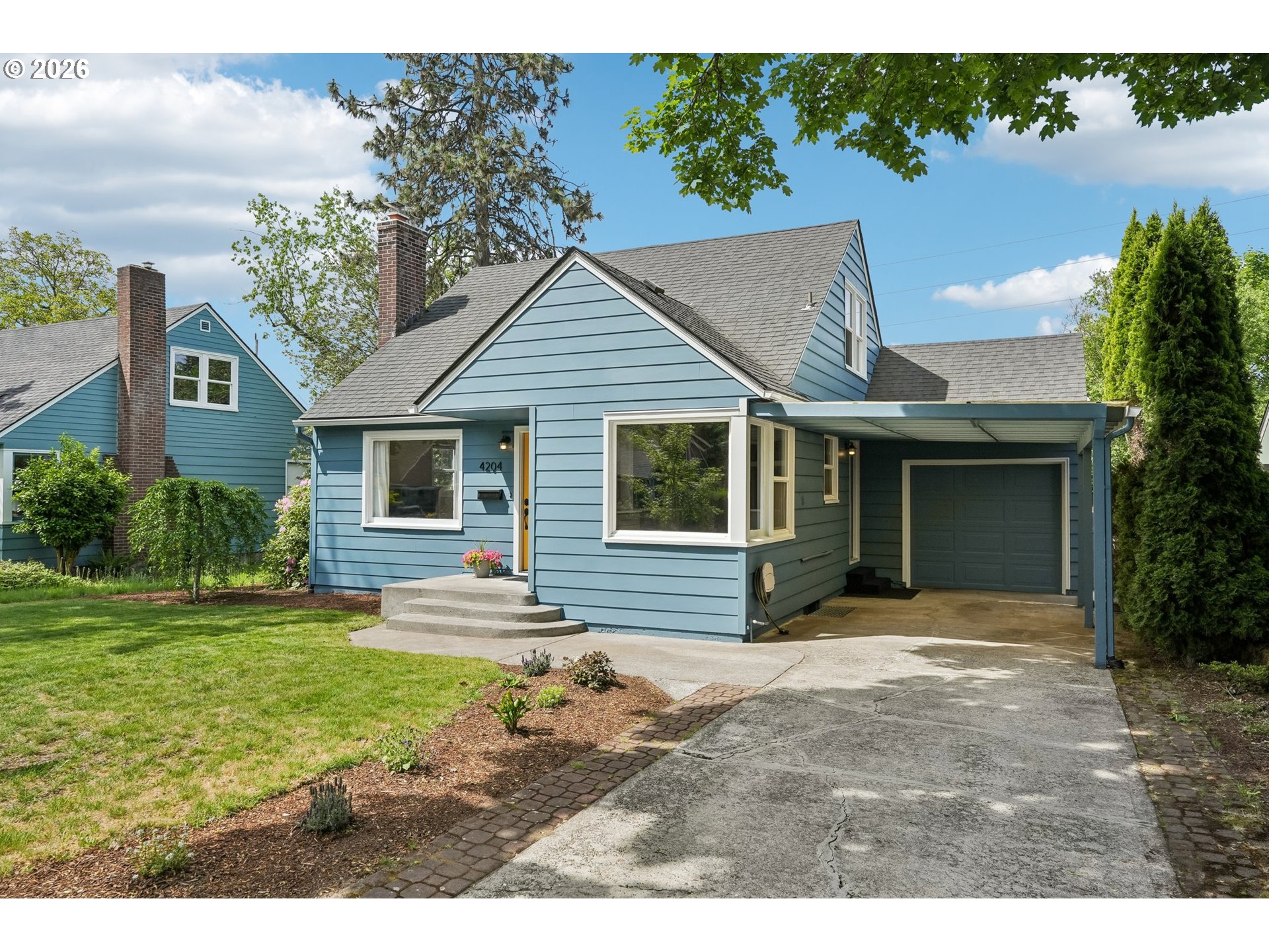 4204 Fir Street Vancouver, WA 98660 - Photo 3 of 37 a front view of a house with a yard and porch