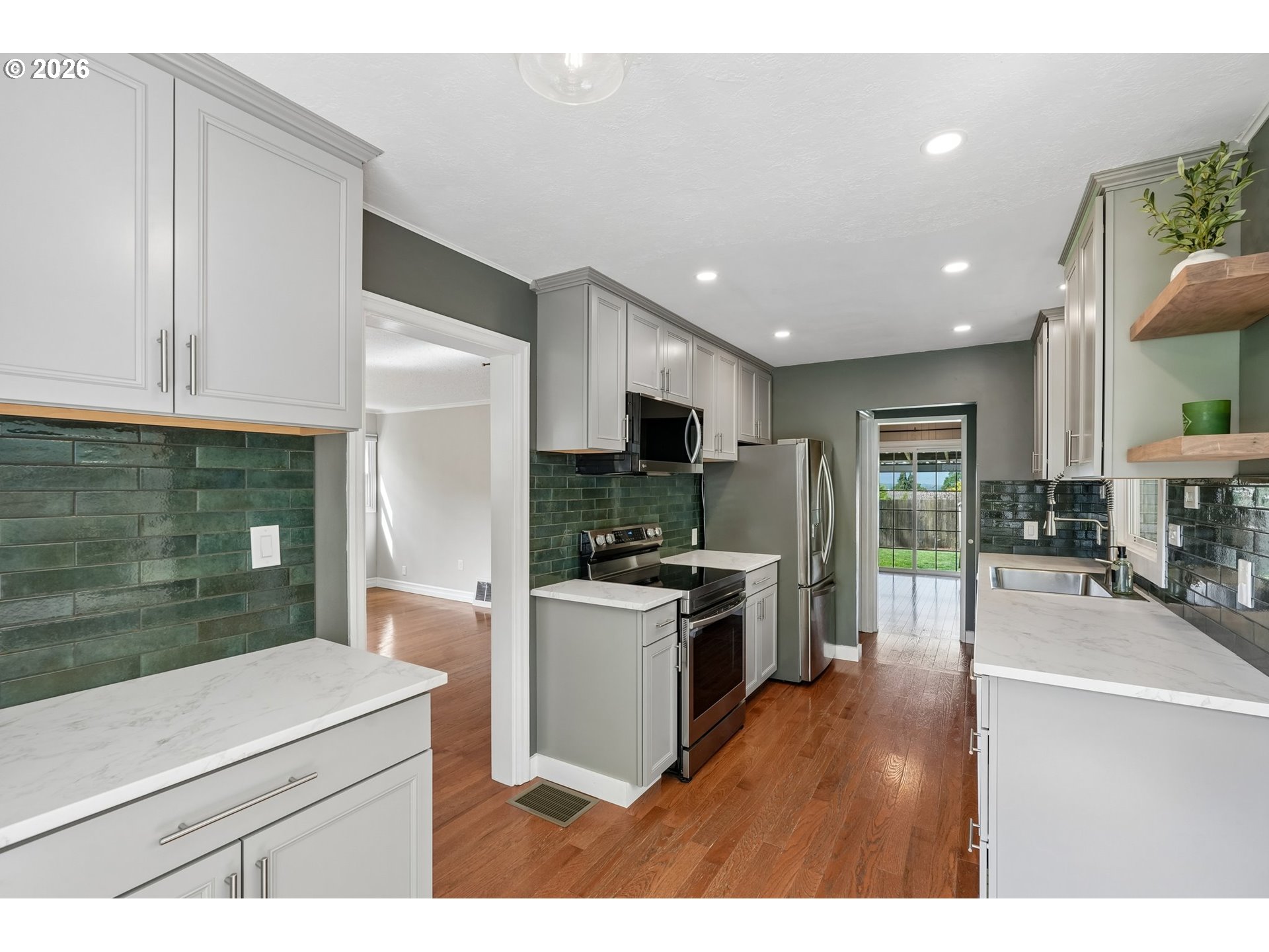 4204 Fir Street Vancouver, WA 98660 - Photo 8 of 37 a kitchen with refrigerator and cabinets
