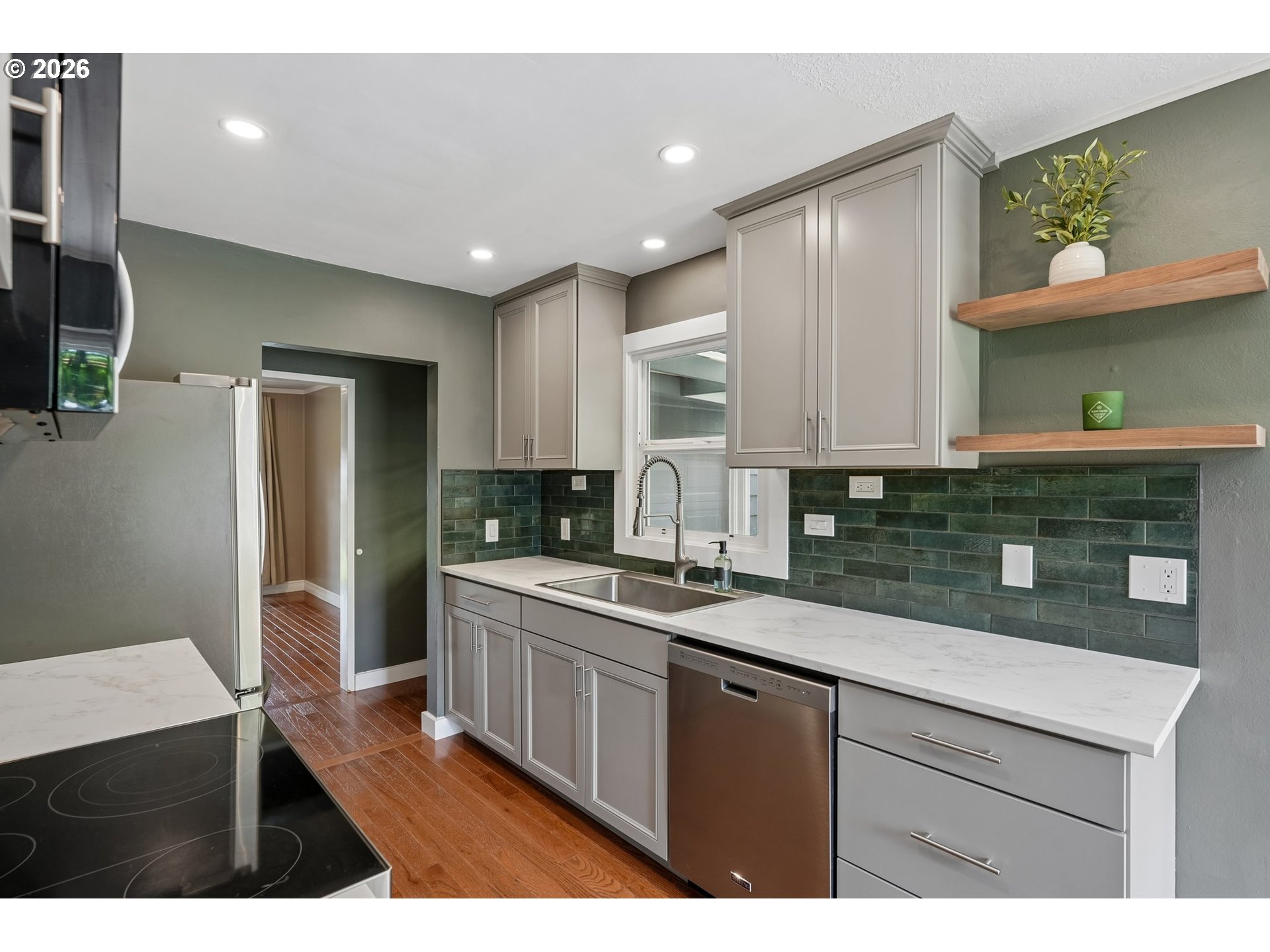 4204 Fir Street Vancouver, WA 98660 - Photo 10 of 37 a kitchen with a sink stainless steel appliances and cabinets
