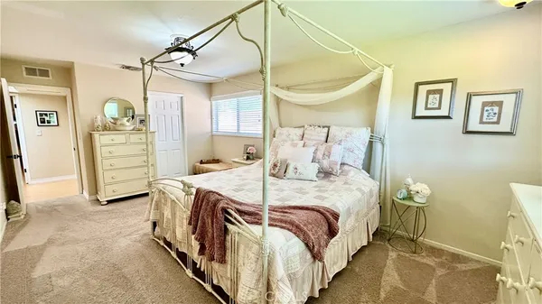 a bedroom with a bed and a walk in closet