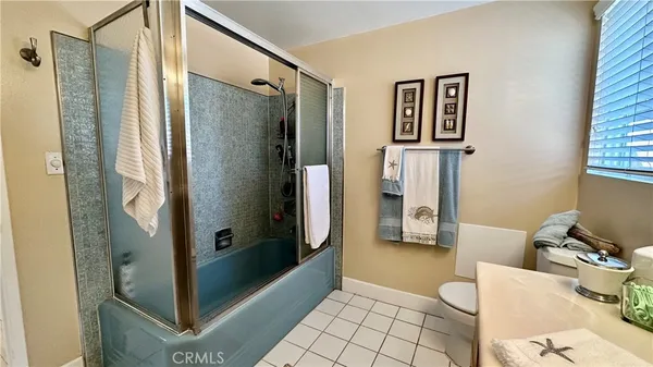 a bathroom with a shower and a toilet