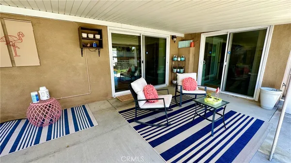 a view of balcony with furniture