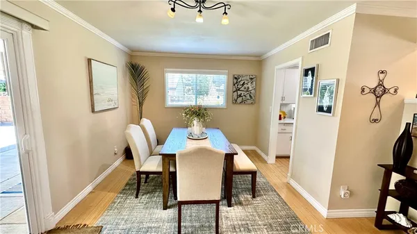 a view of a livingroom with furniture wooden floor and a window
