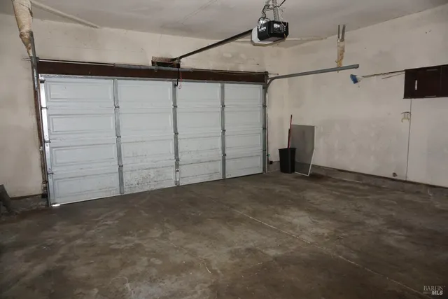 a view of storage and utility room with racks on the wall