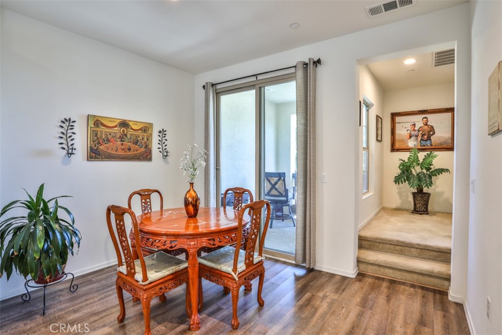 877 Orchid Way Azusa, CA 91702 - Photo 17 of 40 a dining room with furniture and wooden floor