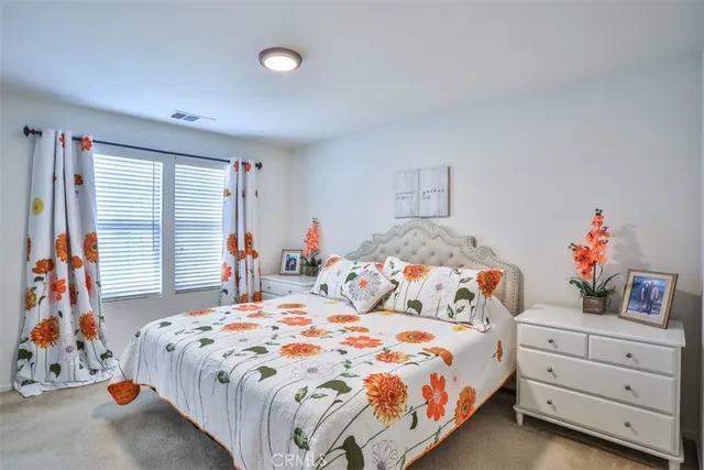 a bedroom with bed and window