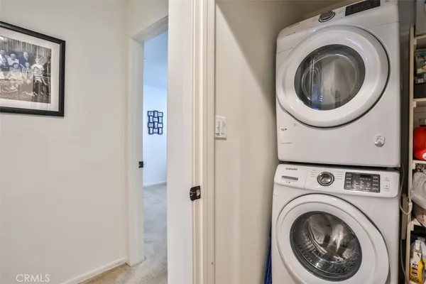 a view of a hallway with washer and dryer