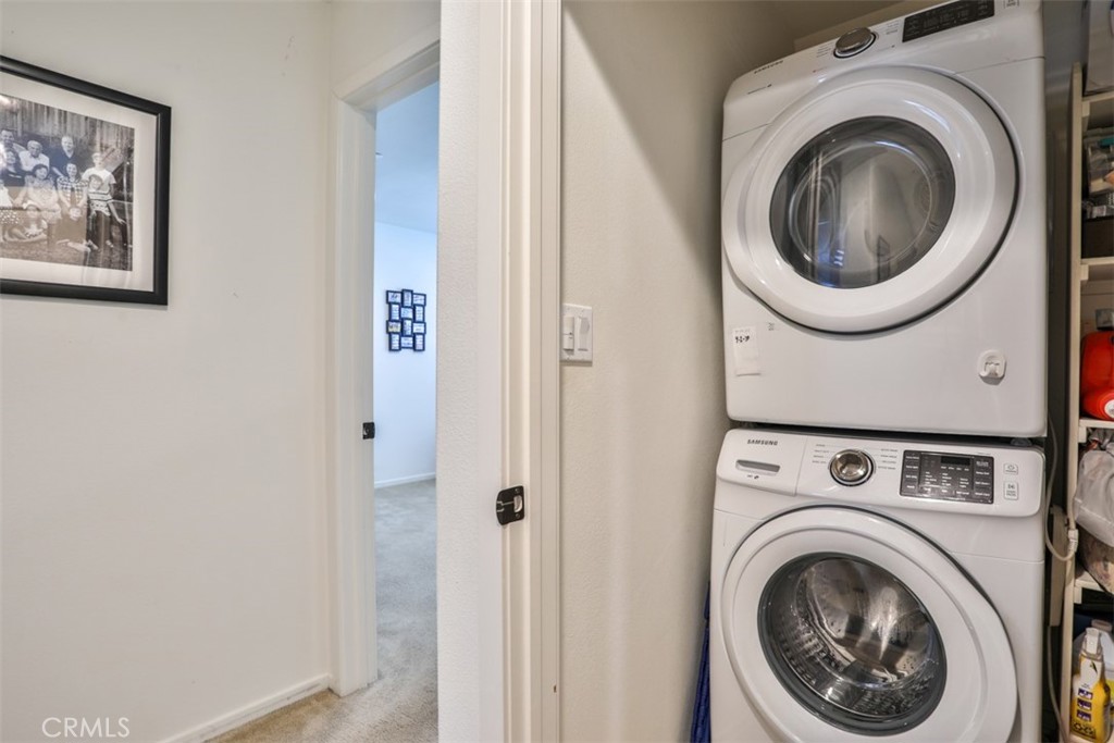 877 Orchid Way Azusa, CA 91702 - Photo 27 of 40 a view of a hallway with washer and dryer