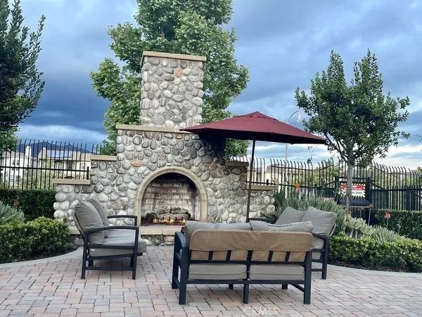 a backyard of a house with table and chairs