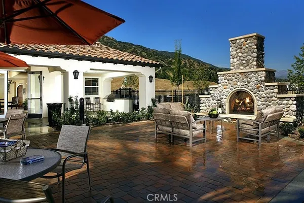 a patio with couches table and chairs