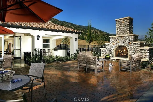a patio with couches table and chairs