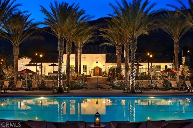 a view of swimming pool with outdoor seating