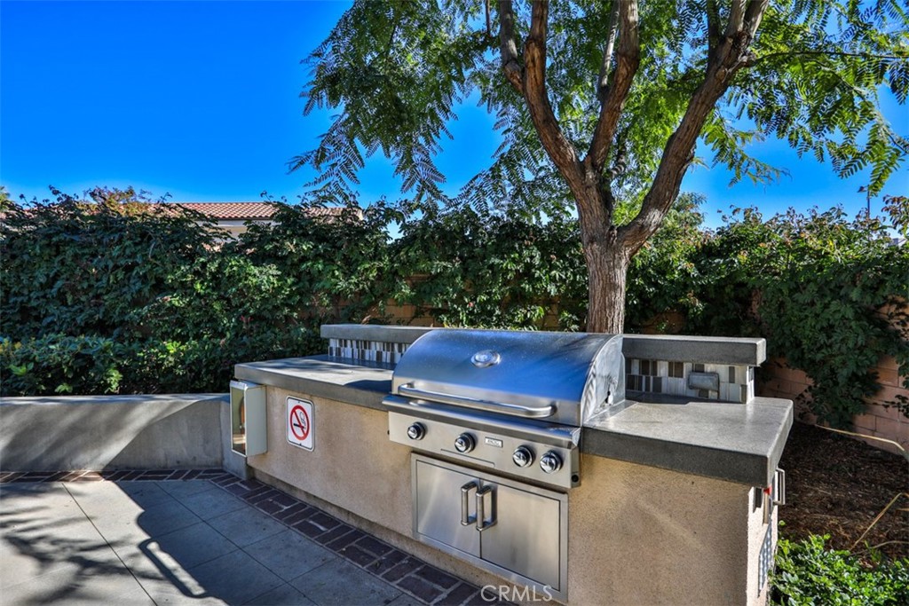 877 Orchid Way Azusa, CA 91702 - Photo 4 of 40 a view of a yard with a wooden fence