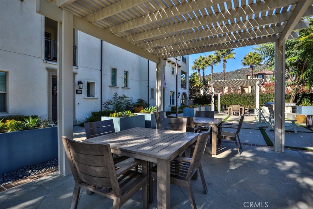 877 Orchid Way Azusa, CA 91702 - Photo 5 of 40 a view of an outdoor dining space with a table and chairs