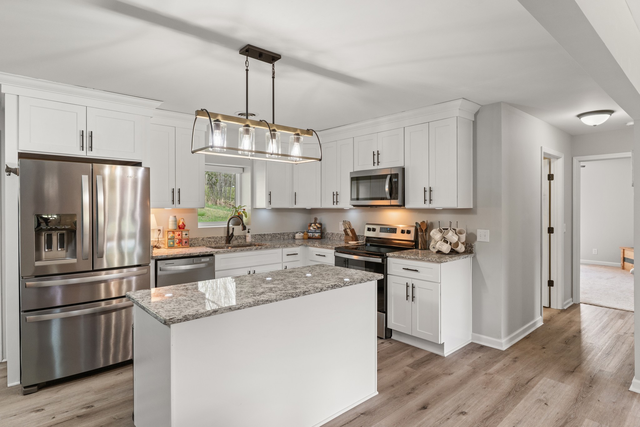 2957 Distillery Road Greenbrier, TN 37073 - Photo 11 of 41 a kitchen with stainless steel appliances granite countertop a refrigerator a stove a sink and a center island