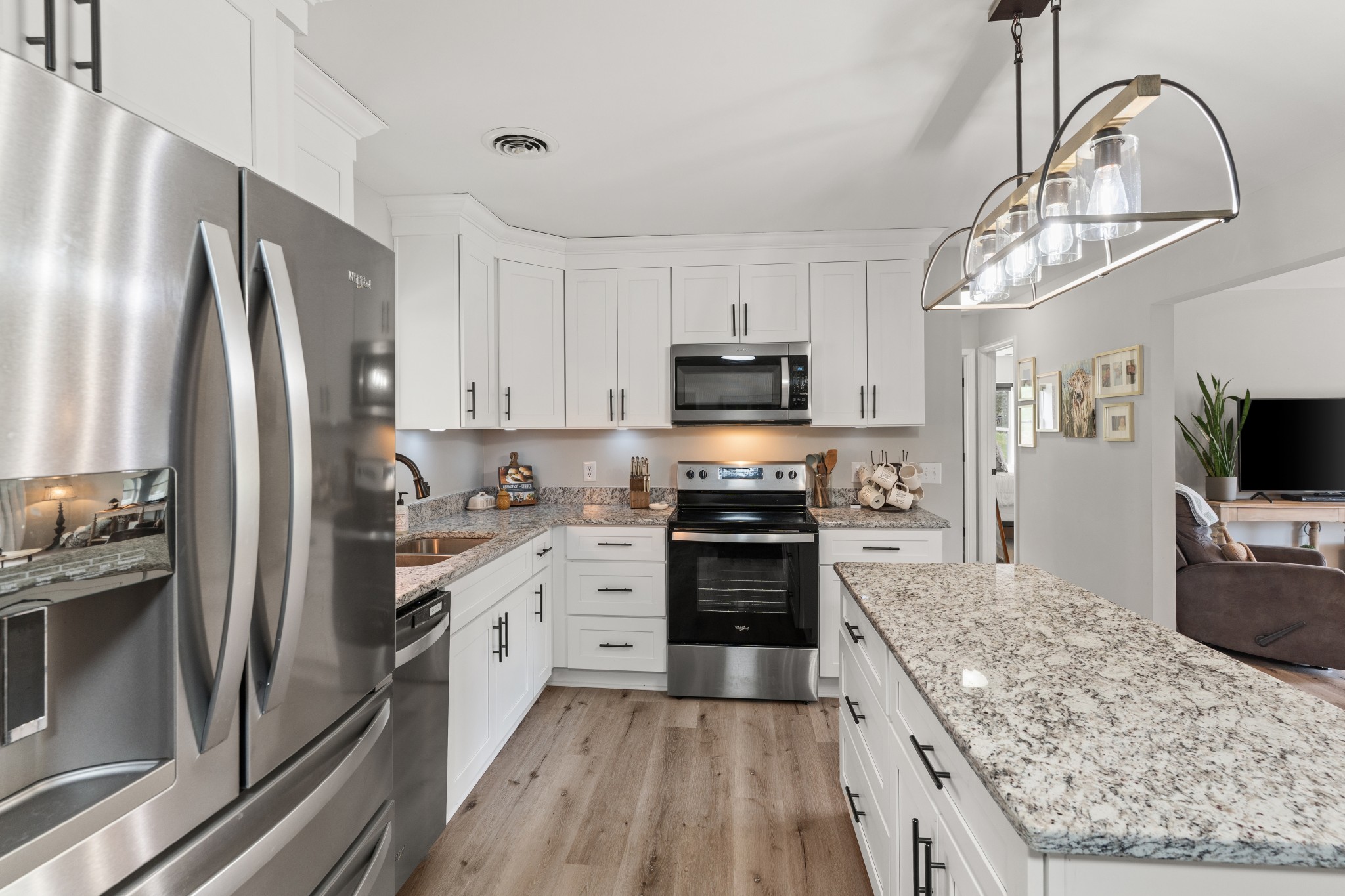 2957 Distillery Road Greenbrier, TN 37073 - Photo 12 of 41 a kitchen with stainless steel appliances granite countertop a refrigerator a stove top oven a sink and dishwasher