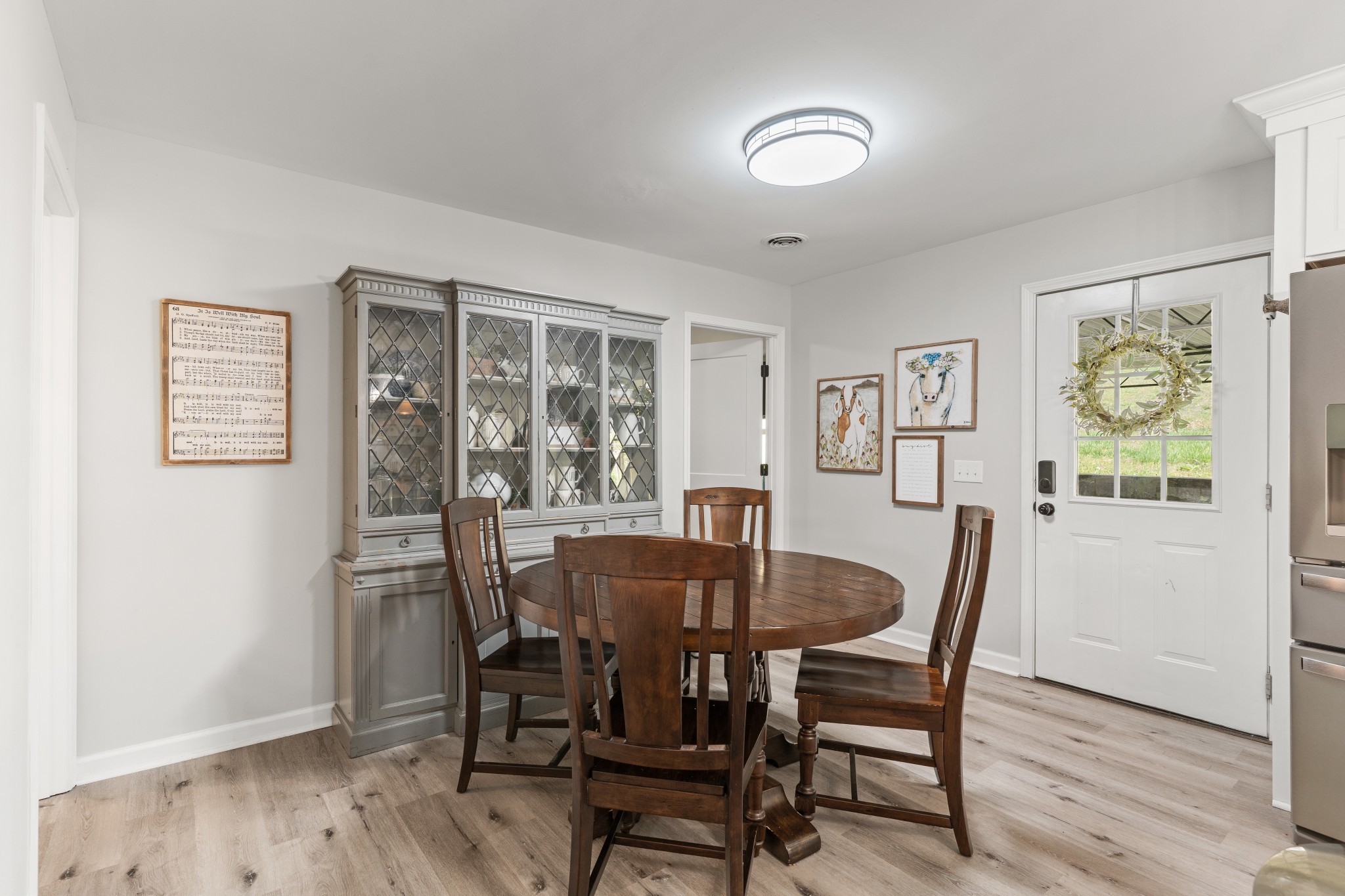 2957 Distillery Road Greenbrier, TN 37073 - Photo 14 of 41 a view of a dining room with furniture window and wooden floor