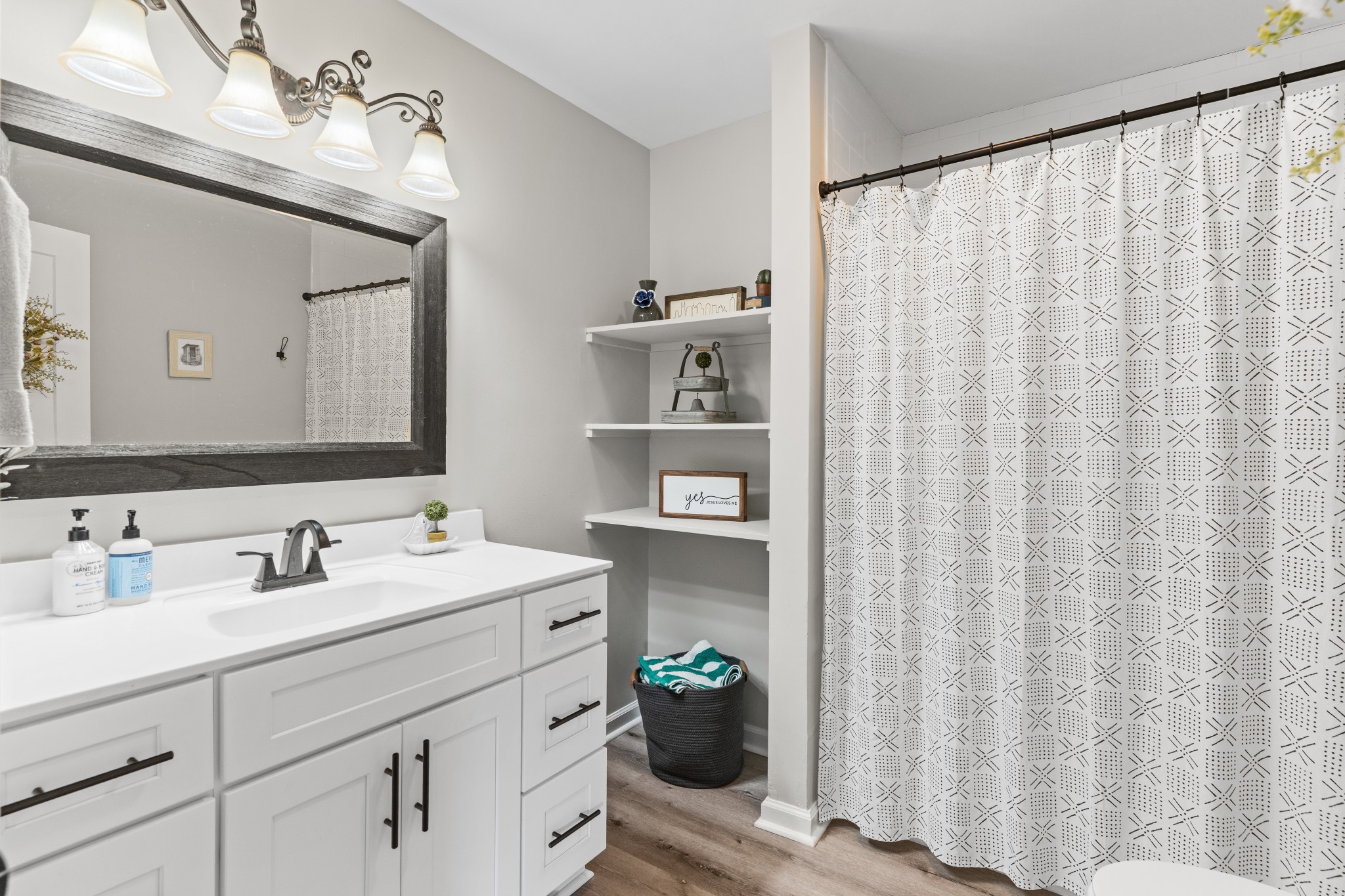 2957 Distillery Road Greenbrier, TN 37073 - Photo 19 of 41 a bathroom with a sink a toilet and a mirror