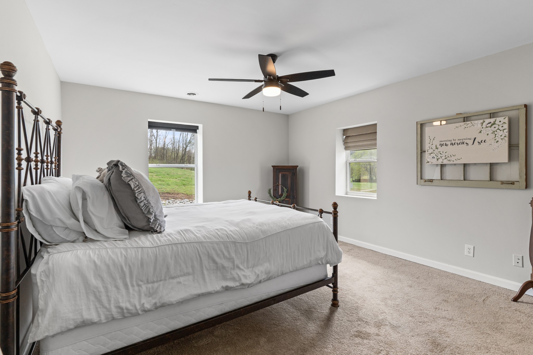2957 Distillery Road Greenbrier, TN 37073 - Photo 20 of 41 a bedroom with a large bed and a chandelier