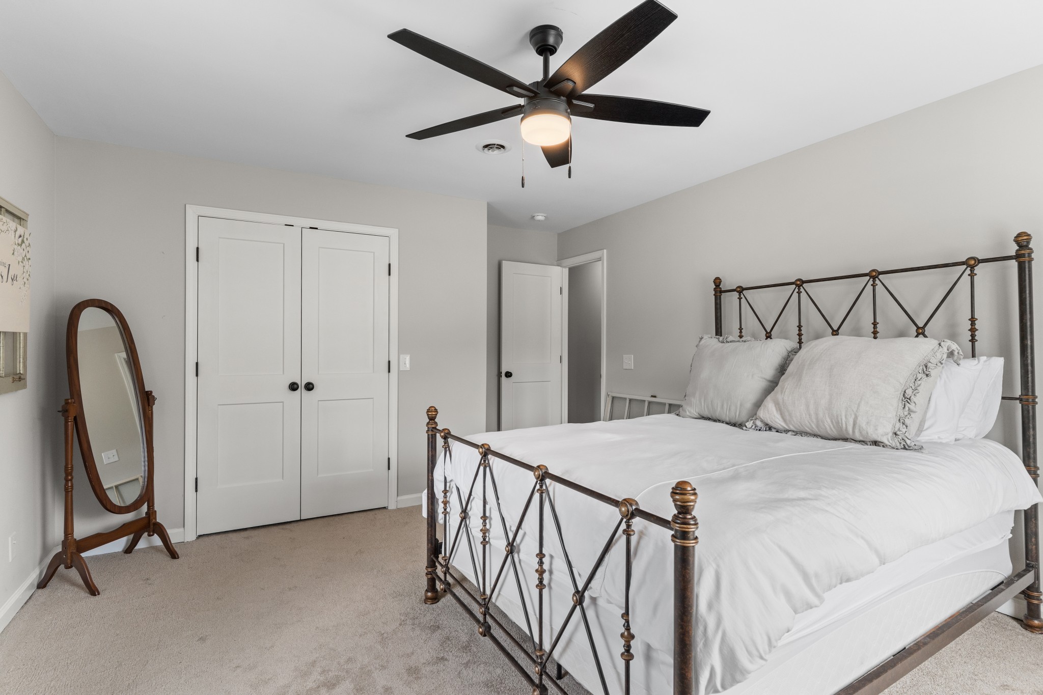 2957 Distillery Road Greenbrier, TN 37073 - Photo 21 of 41 a bedroom with a bed a table and a chandelier