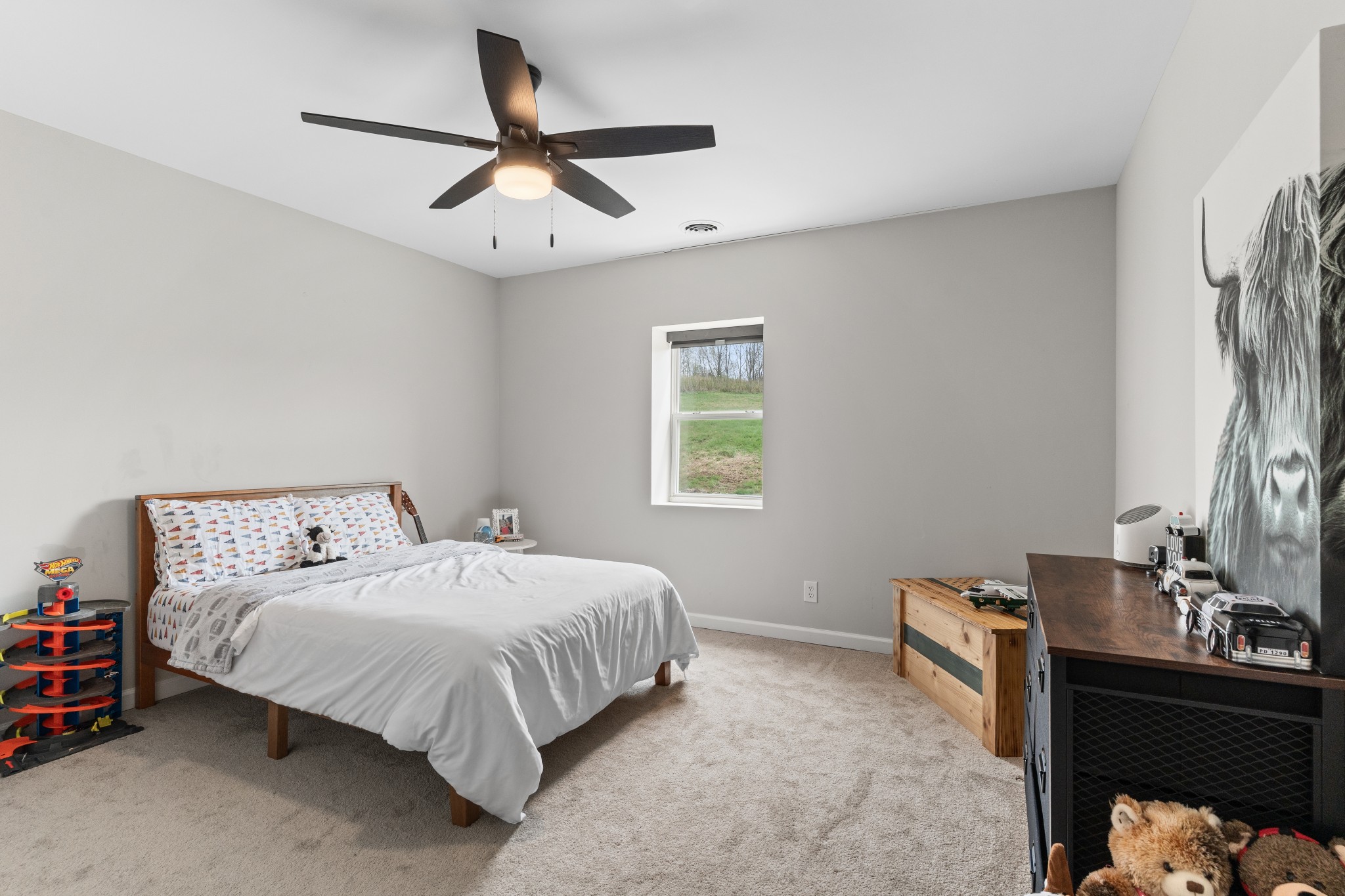 2957 Distillery Road Greenbrier, TN 37073 - Photo 22 of 41 a bedroom with a bed and a chandelier
