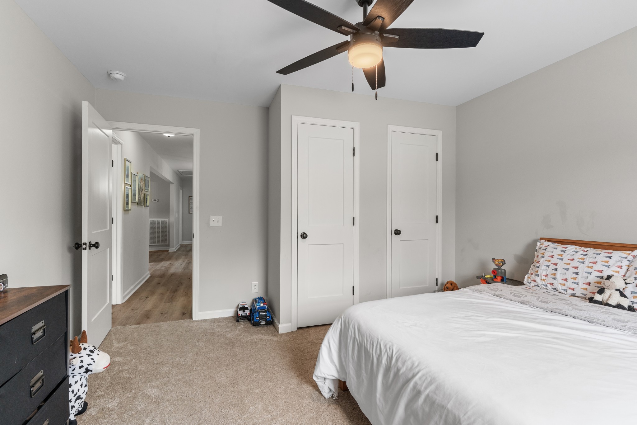 2957 Distillery Road Greenbrier, TN 37073 - Photo 23 of 41 a bedroom with a bed and a chandelier