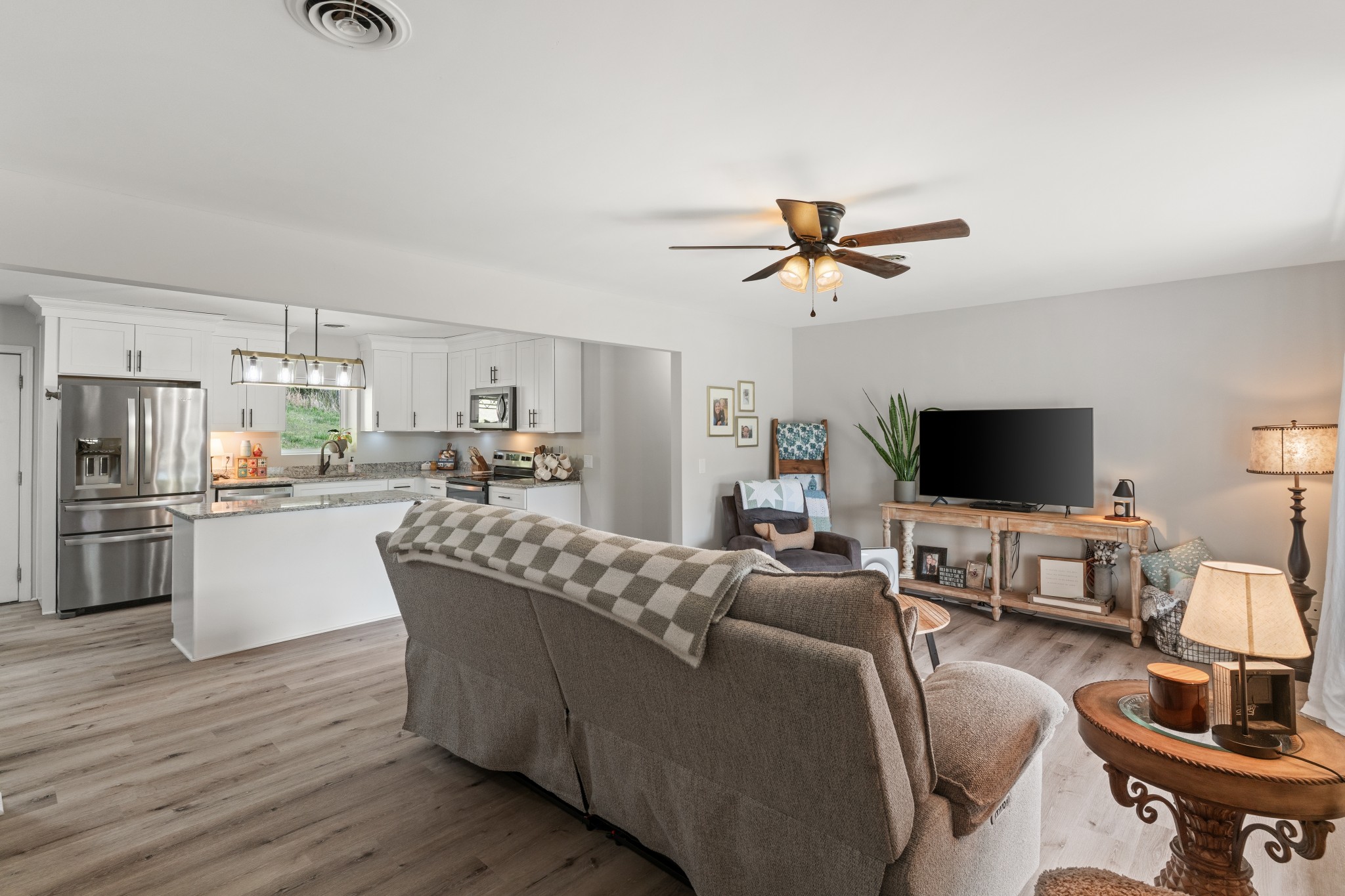 2957 Distillery Road Greenbrier, TN 37073 - Photo 6 of 41 a living room with furniture kitchen view and a flat screen tv