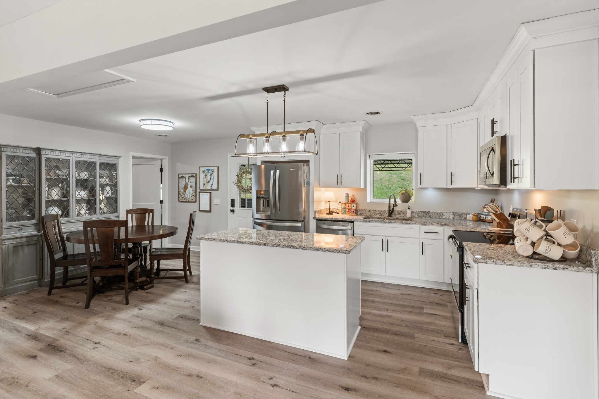 2957 Distillery Road Greenbrier, TN 37073 - Photo 10 of 41 a kitchen with sink cabinets and wooden floor