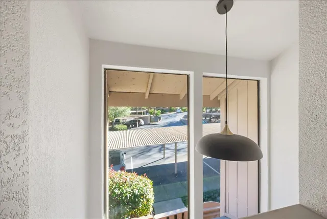 a view of a glass door with a yard