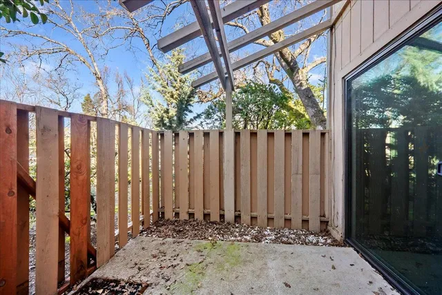 a view of a pathway of a house with a small yard