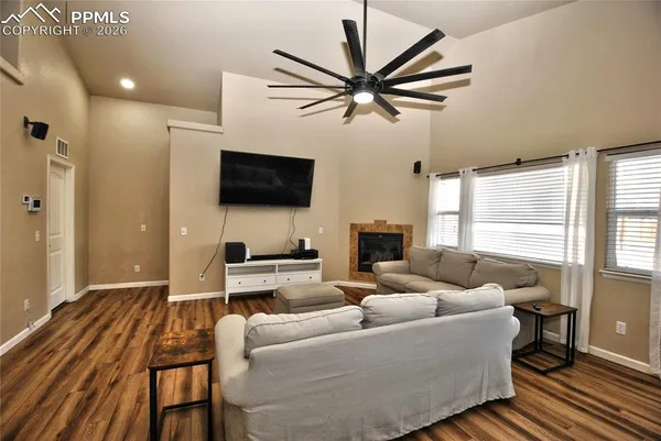 a living room with furniture and a flat screen tv