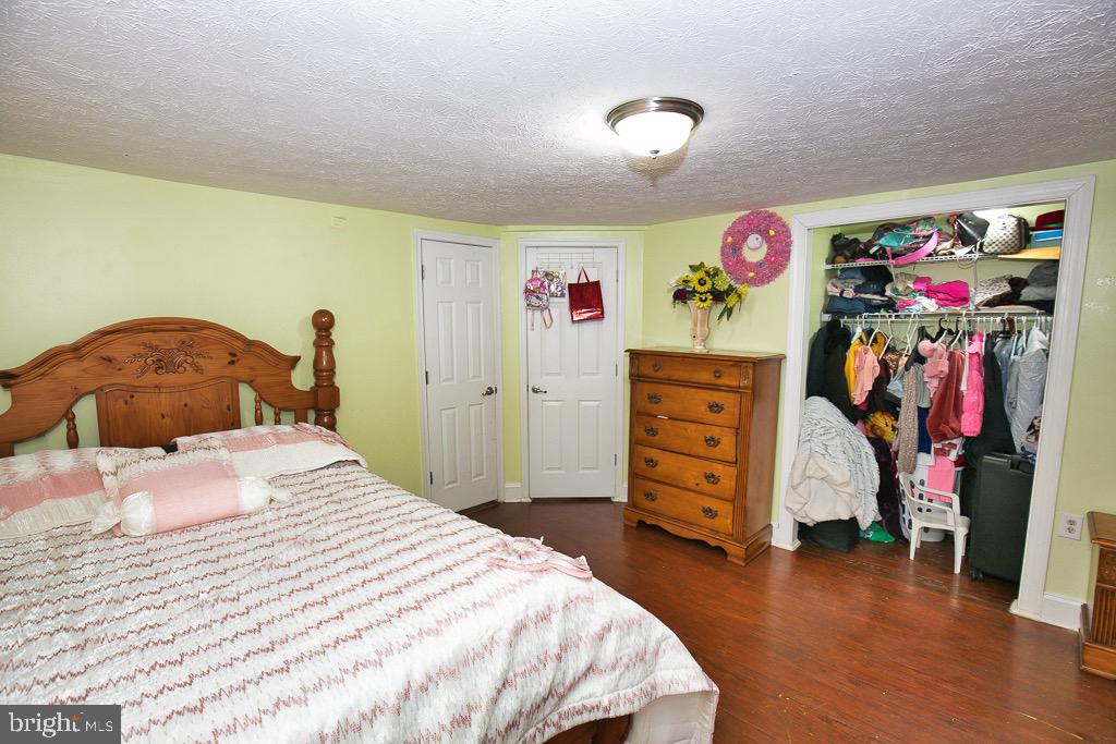 430 Priscilla Street Salisbury, MD 21804 - Photo 55 of 60 a bedroom with a bed and a dresser