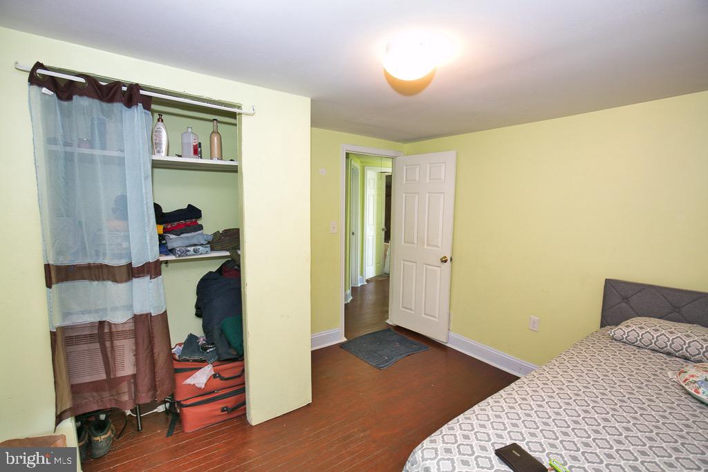 430 Priscilla Street Salisbury, MD 21804 - Photo 60 of 60 a bedroom with a bed and wooden floor