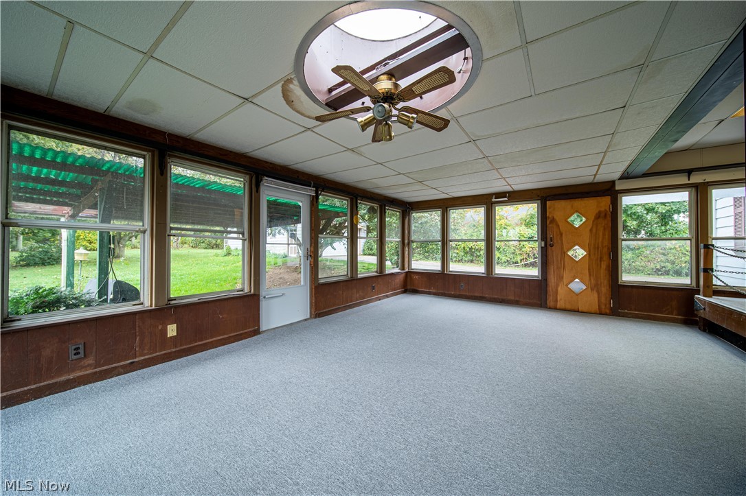 4639 Webb Road Perry, OH 44081 - Photo 21 of 34 To extend your living space, this large room has endless possibilities. Indoor/Outdoor carpet has just been installed just for you.