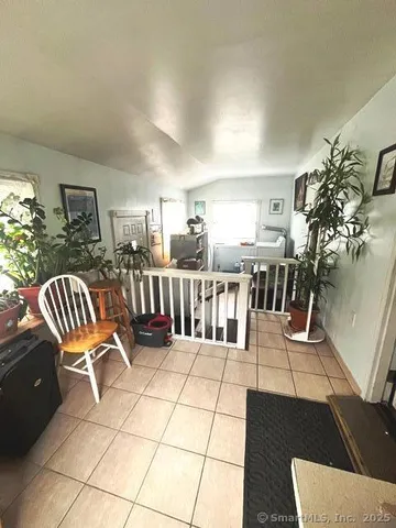a view of a chairs and table in a balcony