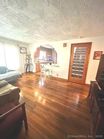 a view of a livingroom with wooden floor